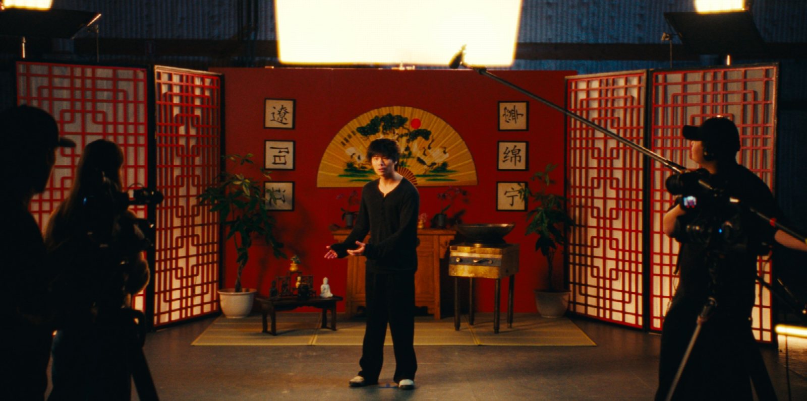 Nathan Xia on set with cinematographer Ayinde Anderson and production designer Annie Becker